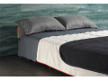 Canapé convertible BK 129 ouvert en lit double dans une chambre